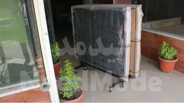 بسته بندی میز پینگ پنگ حرفه ای 25 میل 8 چرخ
